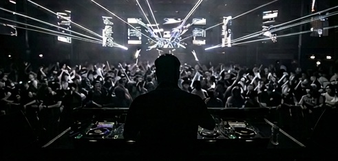 Silhouette of Kalus in a club setting
